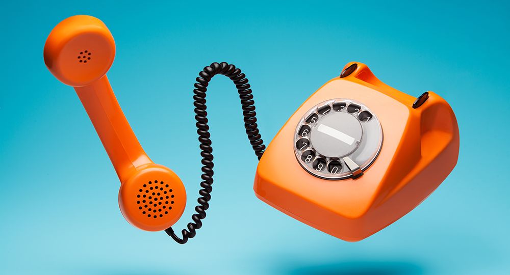 Old,Orange,Telephone,Rings,With,Handset,Off.