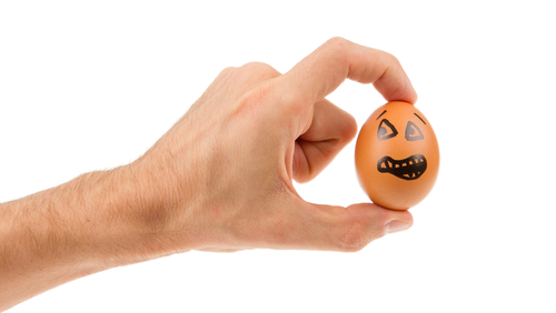 Scared,Egg,,Waiting,To,Be,Grabbed,By,A,Hand,,Isolated