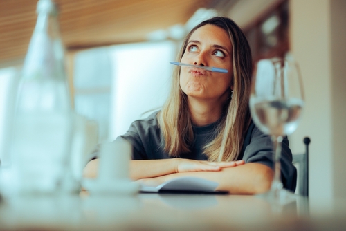 Funny,Girl,Balancing,Pen,On,Her,Lips,Procrastinating,Writing.,Uninspired