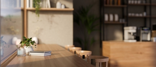 Side,View,Of,A,Long,Wooden,Table,Against,The,Window