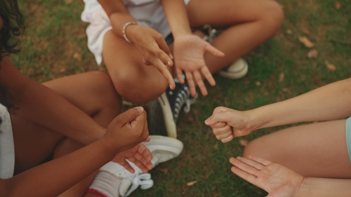 Close-up,Of,The,Hands,Of,Three,Girls,Friends,Pre-teenage,Sitting