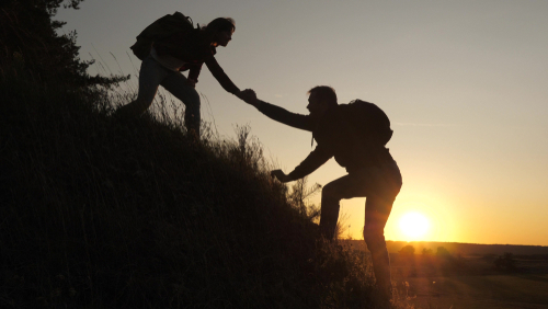 A,Male,Traveler,Holds,Out,His,Hand,To,A,Female