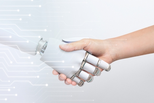Human,Hand,Shaking,Robot,Hand,,Symbolizing,Human-robot,Collaboration,And,Technology.