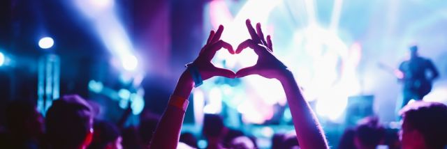 Crowd,At,Concert.,Stage,Lights,And,Hands,In,The,Air.