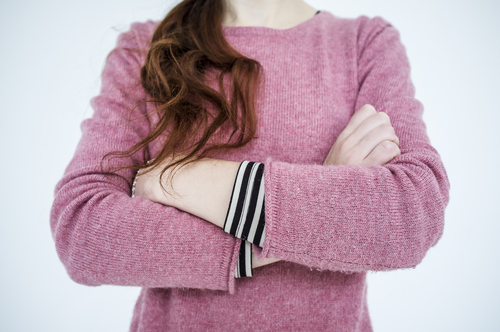 Slim,Young,Girl,Standing,Arms,Crossed,On,White,Background,,Close-up