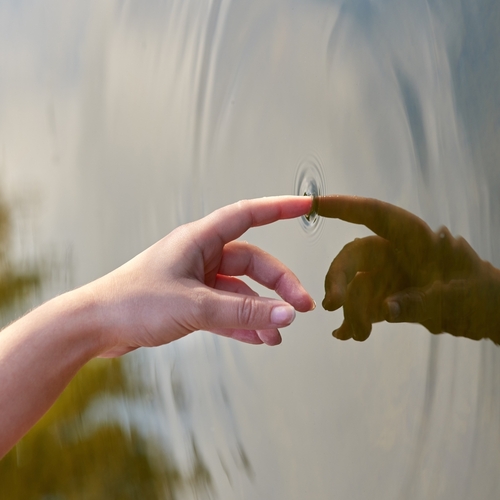 The,Ripple,Effect.,Cropped,Shot,Of,A,Finger,Touching,Water